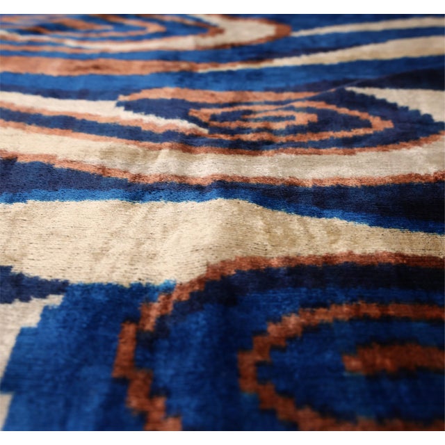 "A refined study in movement and tone, this handcrafted lumbar pillow captures the fluid rhythm of hand-dyed textiles...