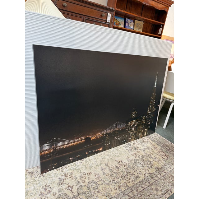 Design Plus Gallery presents a Stretched Canvas Print of the Transamerica Building with the Bay Bridge in San Francisco....