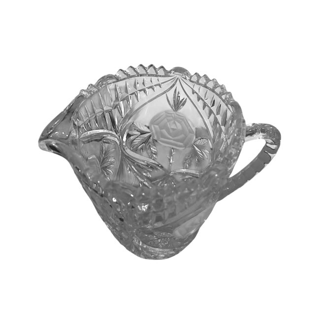 This Beautiful pitcher is heavy crystal cut glass with three frosted roses on the sides and front. A very nice addition to...