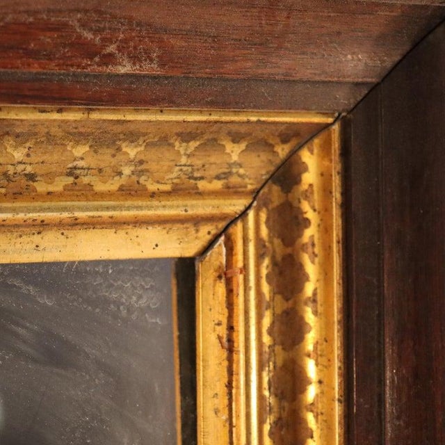 An oversized antique mirror, crafted in the distinguished Renaissance Revival style, dating to approximately 1890. The...