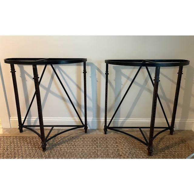 This one of a kind set of demi lune tables are custom made from architecturally salvaged iron. They are intentionally made...