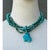 This striking vintage turquoise beaded multi-strand necklace blends timeless Southwestern charm with vibrant, organic...