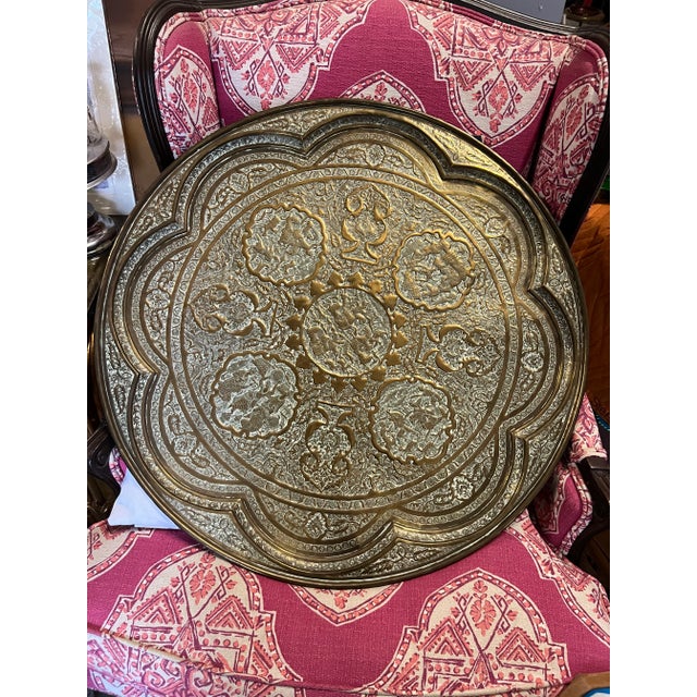 Large handcrafted decorative Indo-Persian brass tray. Embossed and hammered with floral and figural and animals mystique...