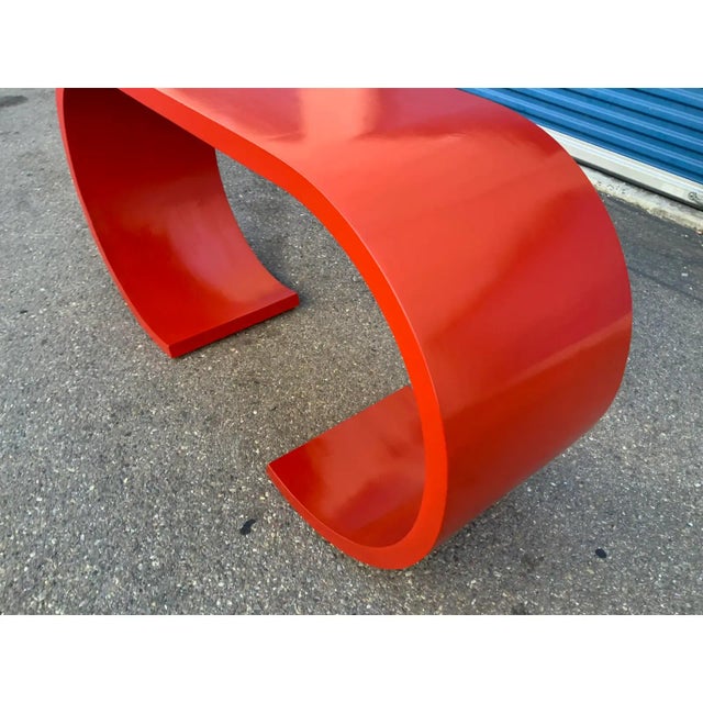 Mid century style waterfall console done in a Ruby red.. Console is made of solid alder. Console has great lines and...