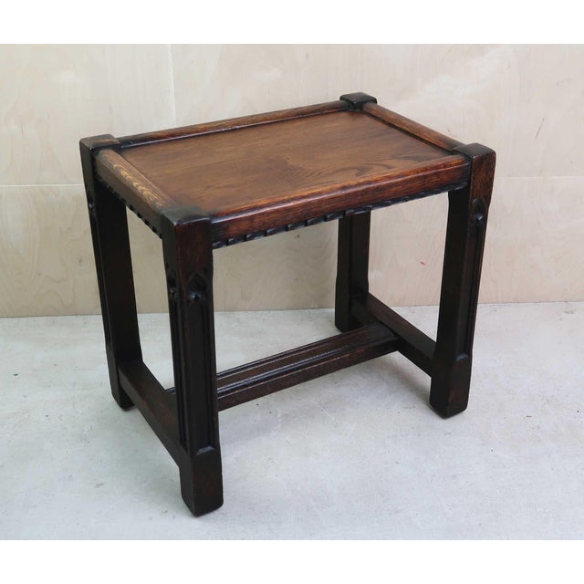 Wonderful carved oak coffee table or stool Lovely colour of oak Very useful size Great for a lamp table Good condition