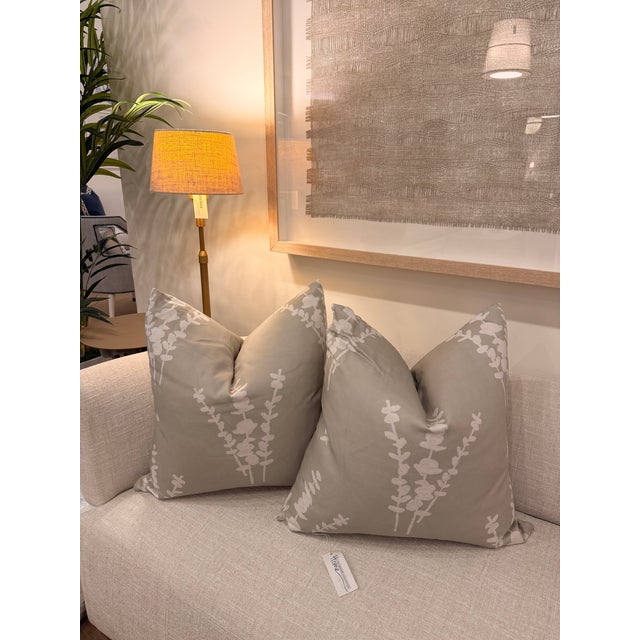 This cotton-linen blend (95% cotton and 5% linen) washable decorative pillow features a soft sage green background...