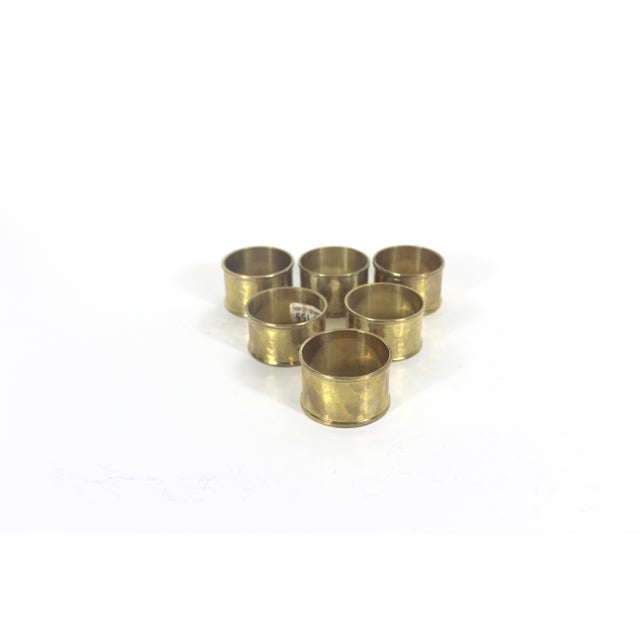 Beautiful set of 6 mid century modern vintage hammered brass napkin rings with some nice patina. Could be polished.