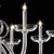 Elegant and sinuous chandelier in trasparent blowing Murano glass and chromed metal frame. Shenographic italian chandelier...