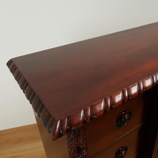 Handsome British Colonial style chest crafted in mahogany, attributed to Ralph Lauren, featuring twenty-one drawers with...