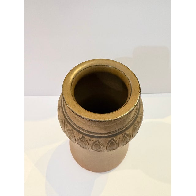 Hand-thrown studio pottery vessel signed by ceramic artist James E. Sanders. This sculptural stoneware piece features a...
