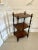 Antique Victorian freestanding rosewood whatnot having three serpentine shaped rosewood shelves supported by eight solid...