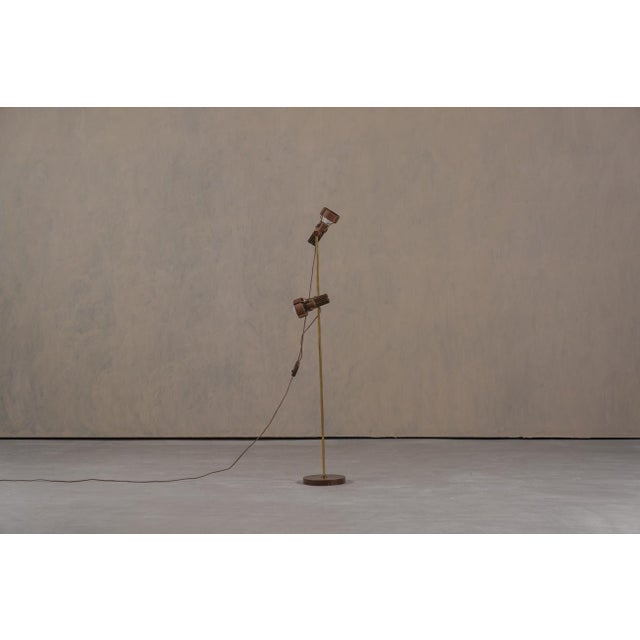 This Mid-Century Modern floor lamp was produced in Germany during the 1970's and combines functionality with a clean,...