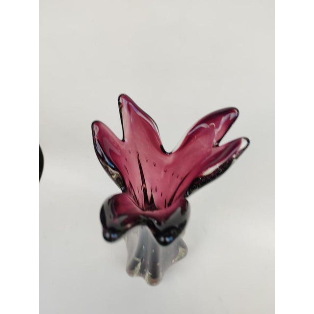 Murano Glass Vase, Amethyst Color. 1950s. Made of bubbled, two-tone glass, its neck is shaped like corollas. A very...