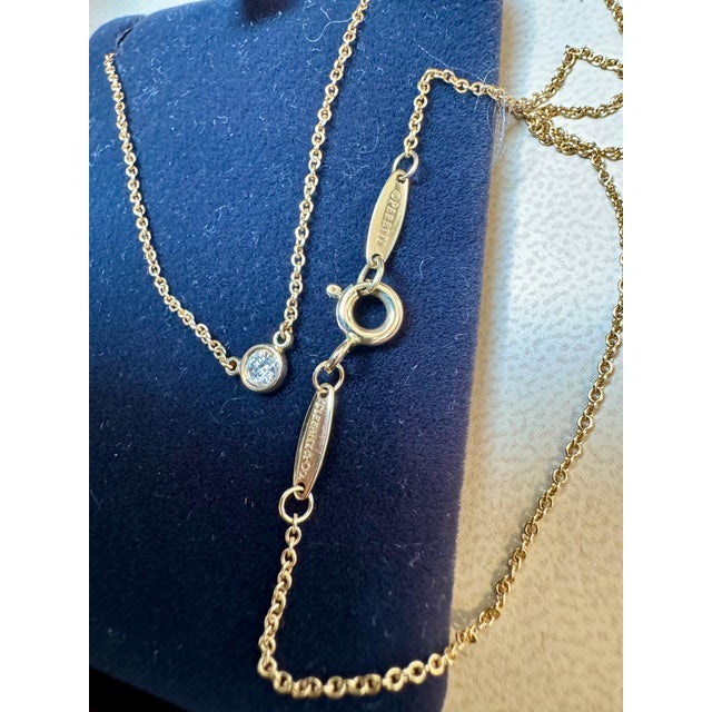 Beautiful Tiffany & Co pendant with single round brilliant cut diamond. Absolutely stunning shine and so perfect for...