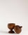 A turned apothecary jar crafted from solid walnut wood, shaped with a rounded body and a softly domed lid finished with a...