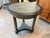 This distinctive round side table brings instant character to any room with its beautifully distressed, hand-painted...