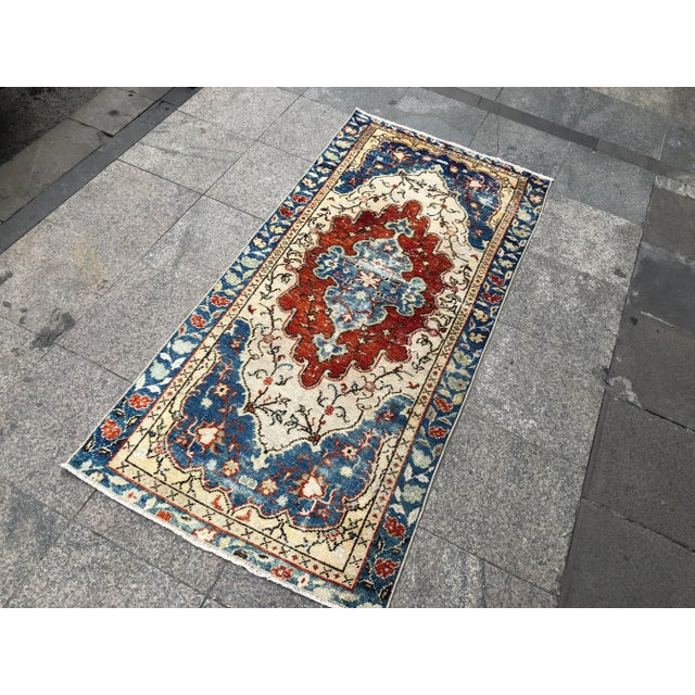 This is a vintage Turkish Oushak rug from the 1960s. The piece was hand-knotted.