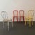 This is a set of four vintage American bent tubular steel café dining chairs. Each chair is lightweight and comprised of...