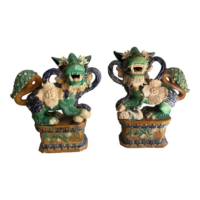Pair of Early 20th Century Sancai Chinoiserie Glazed Terra Cotta Foo Dogs For Sale