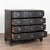 The black finish complements the reserved serpentine curves in this large oak chest of four drawers resting on a scalloped...