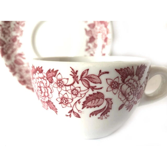 The china is actually white with a reddish design, my camera was being stubborn today. The color in some of the photos is...