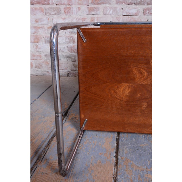 This elegant Bauhaus style table comes from Czechoslovakia from the 1920s. It features a tubular chrome steel frame, which...