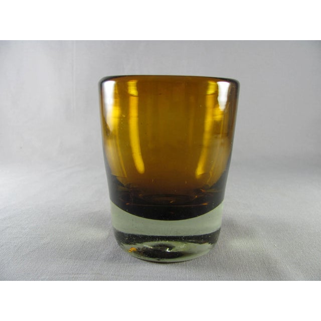 Thick and heavy glass Amber bowl and clear base with tiny bubbles at the bottom Because these are handblown/handmade, each...