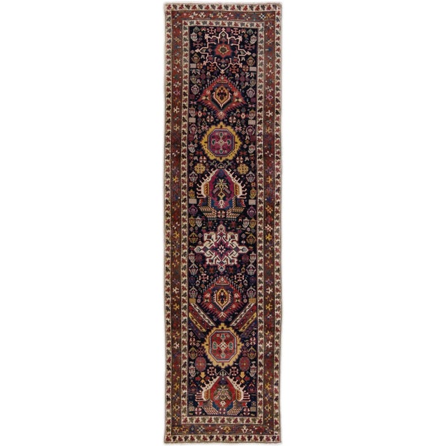Beautiful 20th century antique Caucasian Kazak Hand-knotted wool rug with a blue field. This piece has multicolor fine...