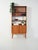 Scandinavian teak bookcase from the 1950s/1960s: base with sliding door and four drawers, upper section with open shelf...