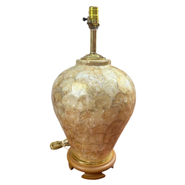 A beautiful vintage mid-century iridescent layered capiz shell lamp with teak wood base. Made in the 1970's, this lamp is...