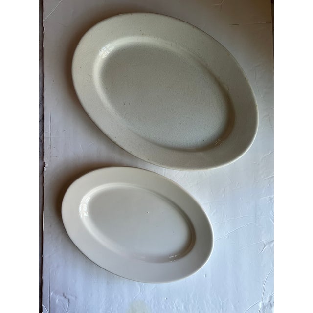 Vintage ironstone platters, large JHM marked on reverse and small Buffalo China. Small measures 12.5 x 8.5 x 1. Large 16 x...