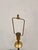 Stylish Barbara Barry Candlestick Lamp, aged brass finish on round base. Showroom Floor sample.