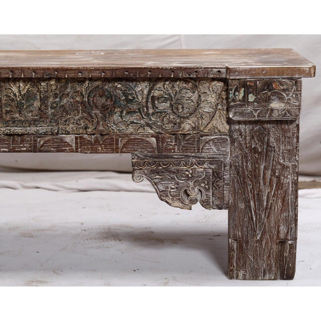 This small bench blends timeworn Indian teak carvings with solid reclaimed wood, creating a grounded, tactile piece full...