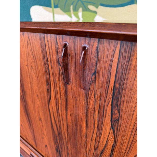 An absolutely striking statement piece! Rosewood grain is unparalleled and a real showstopper. Perfect piece for a living...