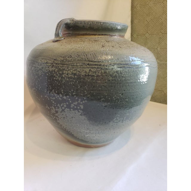 Robust shape and form with beautiful, subdued multi-colored glazing.