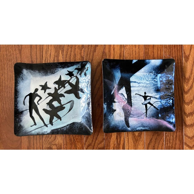 Stunning vintage pair of artisan made enameled copper decorative plates featuring dancers and stars. Signed “Lee” on the...