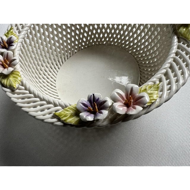 This Vintage Irish Porcelain Woven Basket is a stunning example of Belleek style art pottery. Made in a classic white...