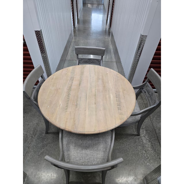 Table: Cameron rustic round dining table. New cost $3,595 48 inch diameter. 66 inches with leaf. Top finish: Dakota...