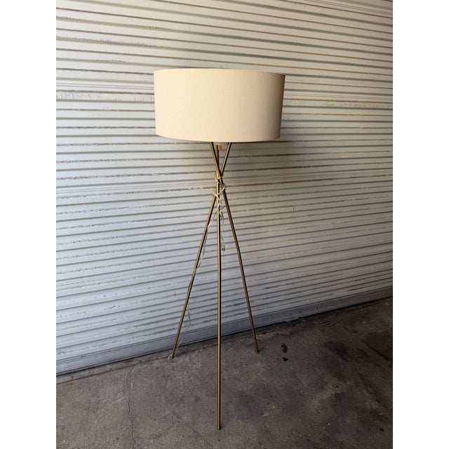 Powder-coated metal. Perforated cone diffuser. Cotton-linen shade. Plug-in. On/off switch located at bottom of perforated...
