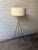 Powder-coated metal. Perforated cone diffuser. Cotton-linen shade. Plug-in. On/off switch located at bottom of perforated...