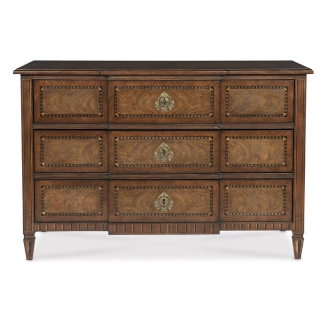 The French Louis XVI 18th-century marquetry chest with neoclassical escutcheons is a fine example of the neoclassical...