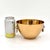 This vintage heavy brass bowl is a stunning piece, featuring "elegant head" rings on each side that add a touch of...