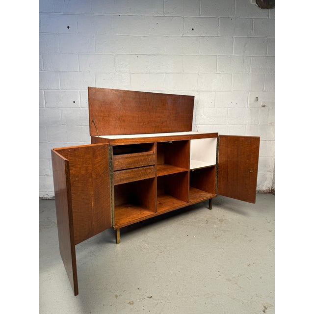 Raise the bar on your home entertaining with this stylish vintage dry bar cabinet, a perfect blend of form and function....