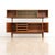Exceptional British mid-century Elm credenza with matching raised display hutch. Featuring clean architectural lines,...
