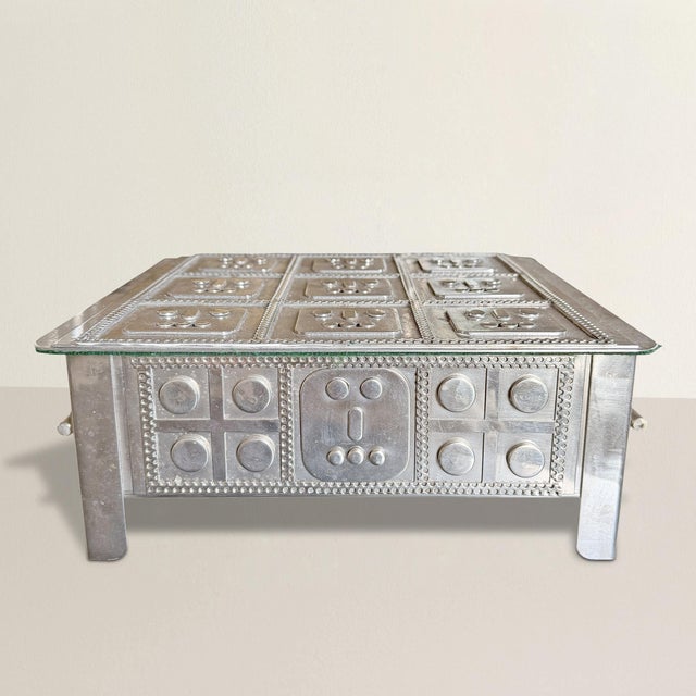 At first glance, it reads as anonymous brilliance—a severe stainless steel box, all sheen and line, as if slipped from the...