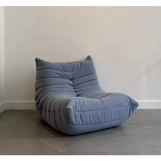 Blue Togo armchair. Designed by Michel Ducaroy for Ligne Roset in the 1970s. Reupholstered here in baby blue fabric. Its...