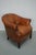 This cognac-colored leather club chair comes from the Netherlands. It is upholstered with cognac-colored leather and...
