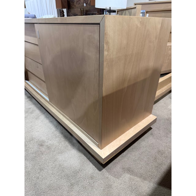 Clean-lined and beautifully proportioned, this modern wood dresser offers a refined balance of form and function. Crafted...