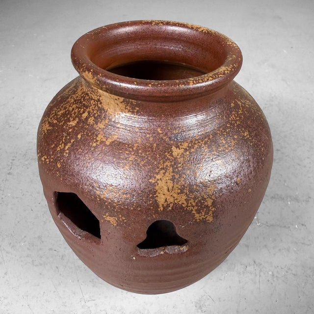 Atmospheric, hand-thrown Japanese vase in Bizen-yaki stoneware, designed for ikebana or a strong, sculptural flower...