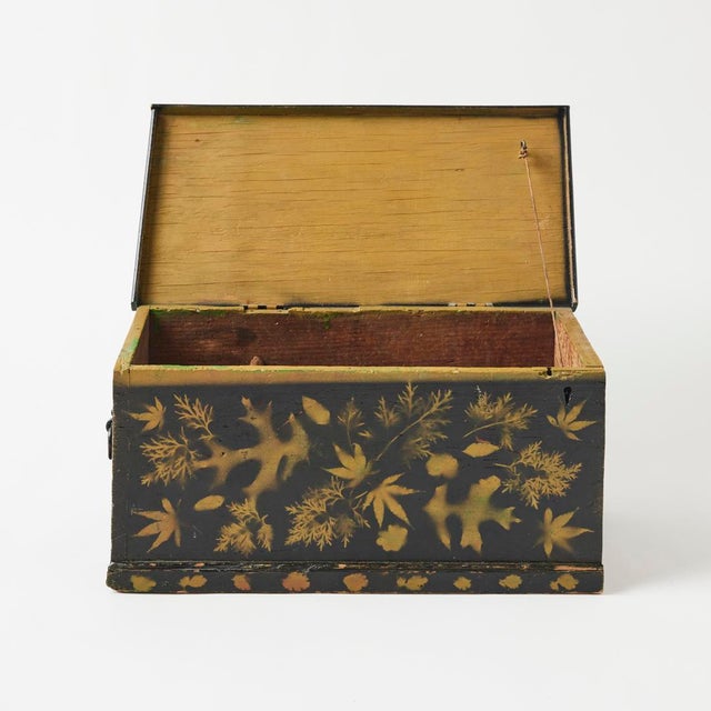 - A truly special object and accent, this antique American trunk is adorned with beautiful painted leaf motifs set against...